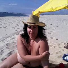 Showing tits on the beach