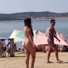 Crazy girl dancing naked at public beach